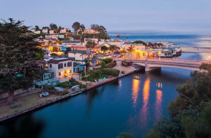 Bridges over Soquel Creek and village at dusk. Capitola, California, USA